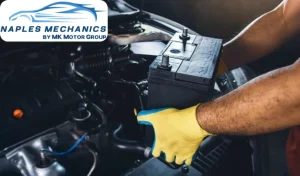 Testing a car battery in Florida heat at a Naples auto shop