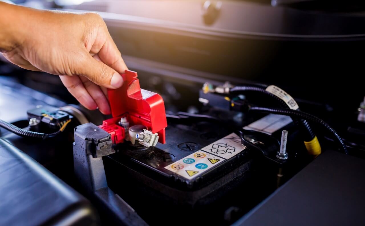 Removing battery terminal cover, battery service Marco Island, FL