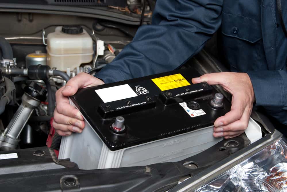 Mechanic replacing car battery, battery service Marco Island, FL